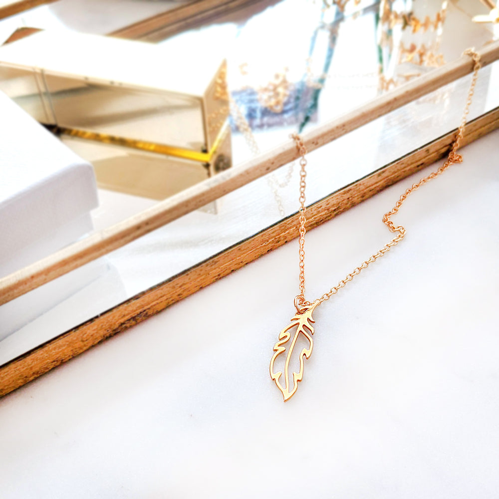 
                
                    Load image into Gallery viewer, Tiny gold Feather Necklace
                
            