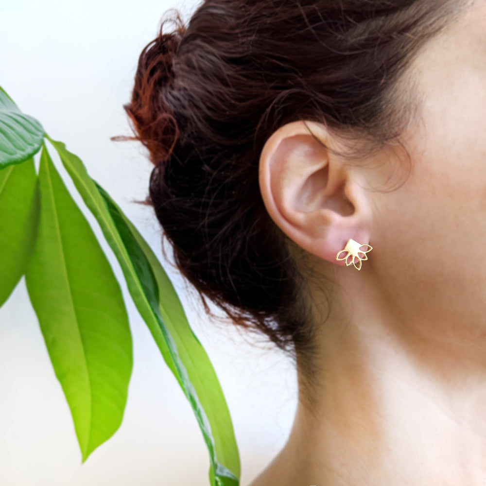Tiny Lotus Flower studs earrings on a model