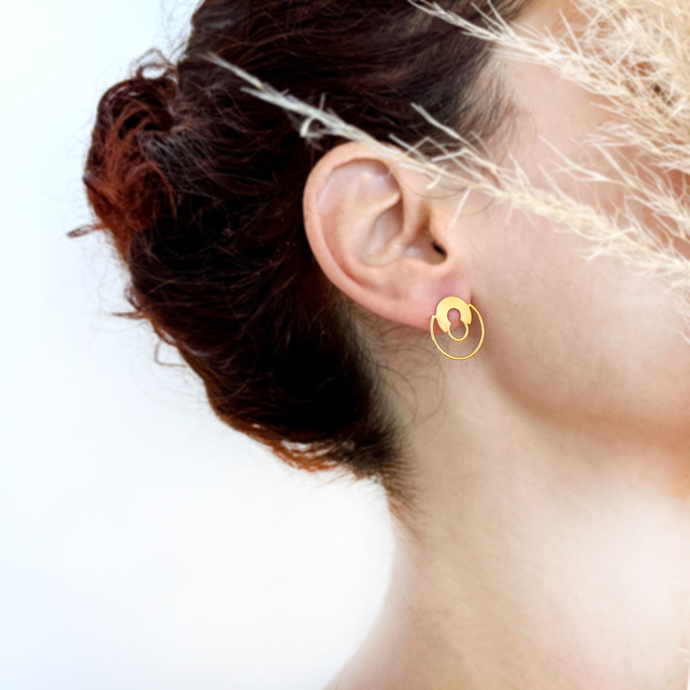 
                
                    Load image into Gallery viewer, Round Lock minimalist stud Earrings gold on model
                
            